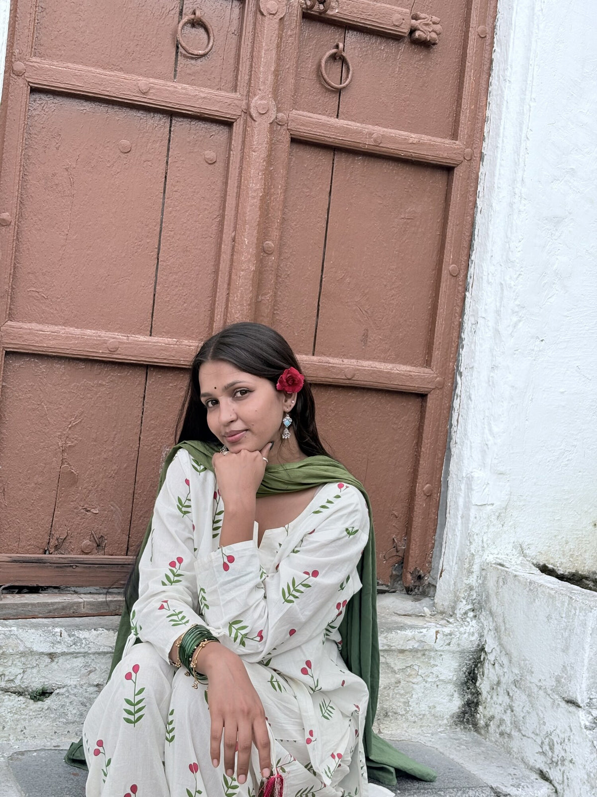 Ms Garden floral kurta set seated portrait