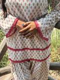 Gulabi Noor 2 ivory kurta set styled outdoors