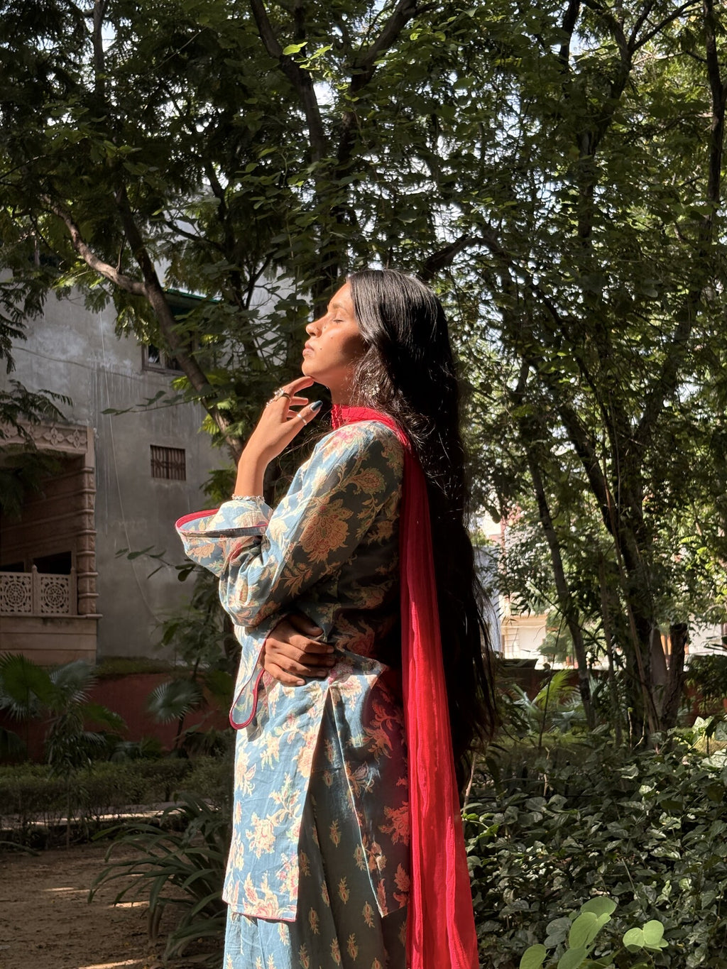 Rang-e-Saheli blue floral co-ord in a garden